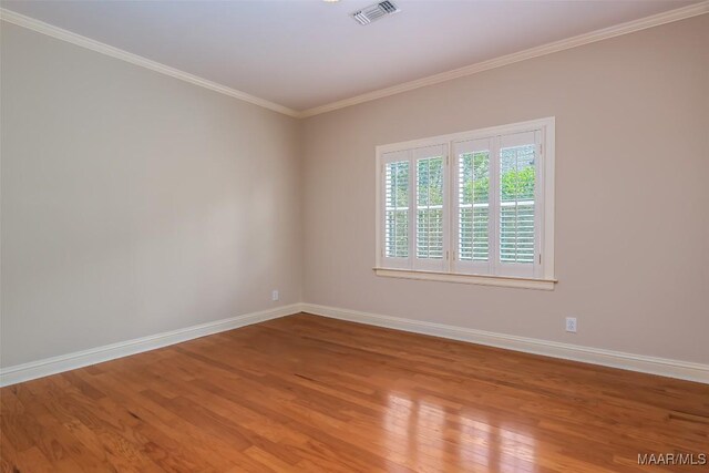 8180 Longneedle Pl, Montgomery, AL 36117 - unfurnished room with wood finished floors, baseboards, and ornamental molding