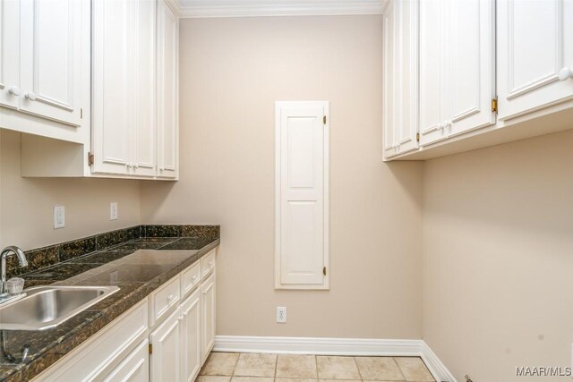 8180 Longneedle Pl, Montgomery, AL 36117 - washroom with baseboards, a sink, and light tile patterned floors