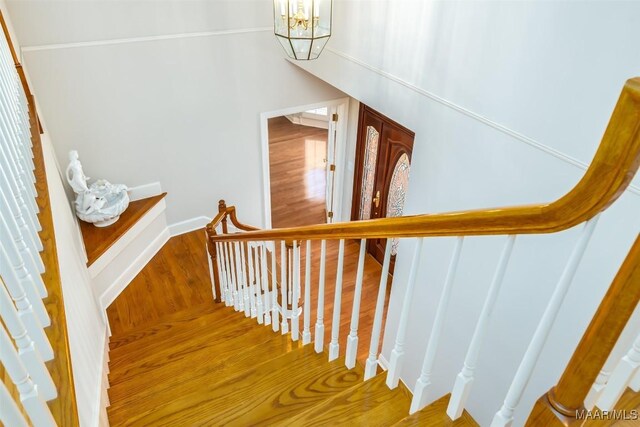 8180 Longneedle Pl, Montgomery, AL 36117 - stairs with a chandelier, wood finished floors, and baseboards