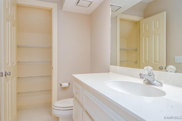 8180 Longneedle Pl, Montgomery, AL 36117 - bathroom featuring toilet, vanity, and a walk in closet