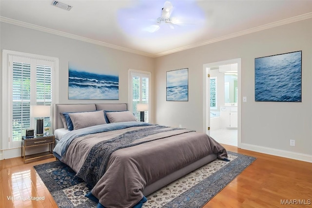 8180 Longneedle Pl, Montgomery, AL 36117 - bedroom with crown molding, light wood-style floors, baseboards, ensuite bath, and ceiling fan