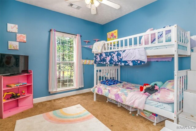 bedroom featuring carpet, a ceiling fan, and baseboards