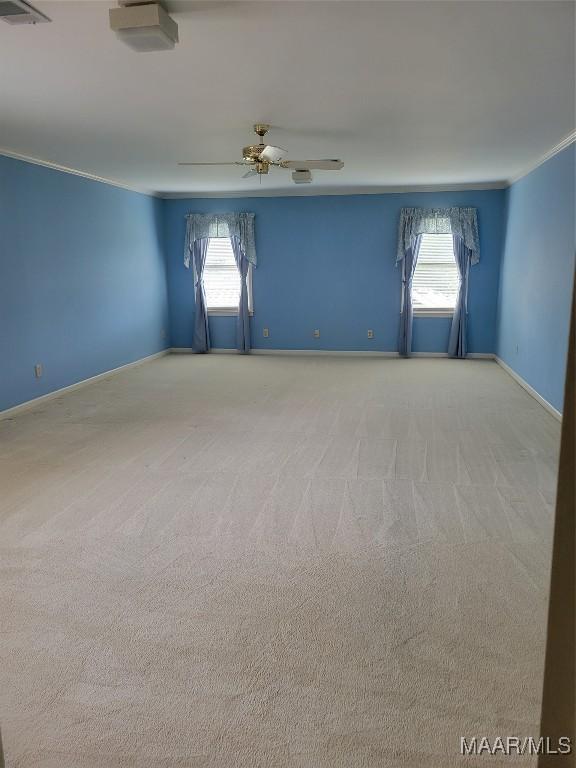 1550 Meriwether Rd, Montgomery, AL 36117 - unfurnished room featuring light colored carpet, baseboards, and a ceiling fan