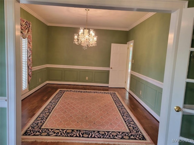 1550 Meriwether Rd, Montgomery, AL 36117 - unfurnished dining area featuring dark wood-type flooring, a chandelier, crown molding, and wainscoting