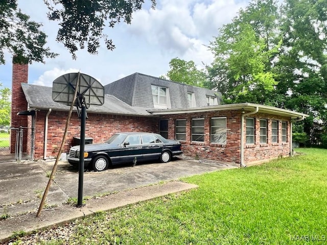 3600 Hunting Creek Rd, Montgomery, AL 36116 - view of property exterior featuring brick siding, a lawn, a chimney, and a shingled roof