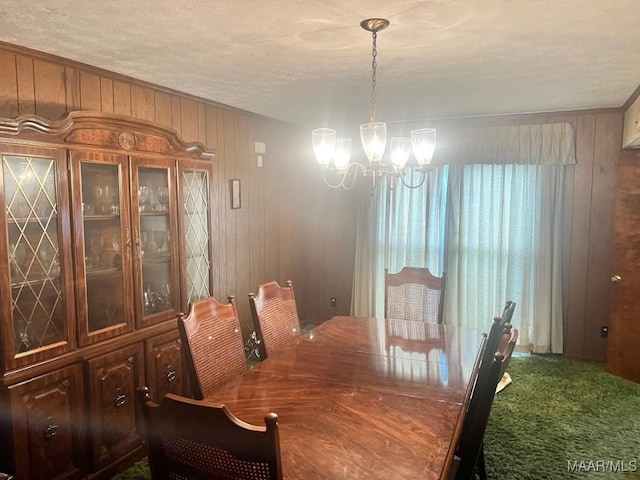 3600 Hunting Creek Rd, Montgomery, AL 36116 - carpeted dining area with a chandelier, wood walls, and a textured ceiling