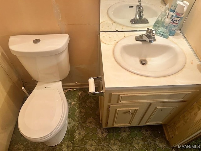 3600 Hunting Creek Rd, Montgomery, AL 36116 - half bathroom featuring vanity, toilet, and tile patterned floors