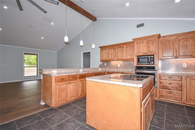 6790 Upper River Rd, Tallassee, AL 36078 - kitchen with stainless steel appliances, beam ceiling, a kitchen island, backsplash, and light countertops