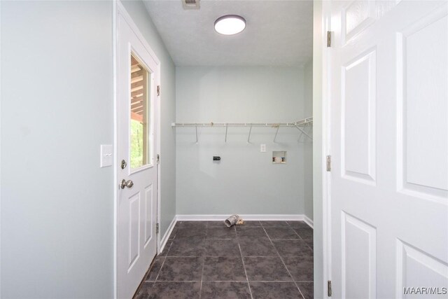 6790 Upper River Rd, Tallassee, AL 36078 - laundry area with baseboards, washer hookup, dark tile patterned flooring, and hookup for an electric dryer