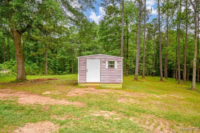 6790 Upper River Rd, Tallassee, AL 36078 - view of shed featuring a forest view