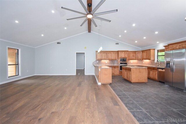 6790 Upper River Rd, Tallassee, AL 36078 - kitchen featuring stainless steel appliances, ceiling fan, a center island, beamed ceiling, and light countertops