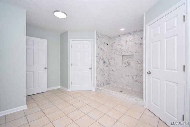 6790 Upper River Rd, Tallassee, AL 36078 - bathroom featuring a stall shower, tile patterned flooring, baseboards, and recessed lighting