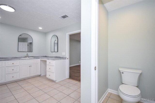 6790 Upper River Rd, Tallassee, AL 36078 - bathroom with toilet, vanity, tile patterned flooring, recessed lighting, and baseboards