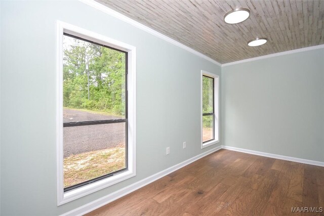 6790 Upper River Rd, Tallassee, AL 36078 - empty room featuring plenty of natural light, dark wood finished floors, ornamental molding, and baseboards