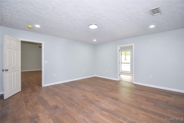 6790 Upper River Rd, Tallassee, AL 36078 - unfurnished room with wood finished floors, baseboards, a textured ceiling, and recessed lighting