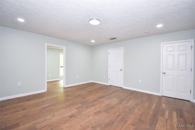 6790 Upper River Rd, Tallassee, AL 36078 - spare room featuring wood finished floors, baseboards, recessed lighting, and a textured ceiling