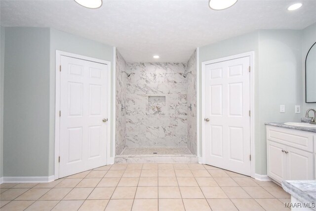 6790 Upper River Rd, Tallassee, AL 36078 - full bath featuring a tile shower, vanity, tile patterned floors, recessed lighting, and baseboards