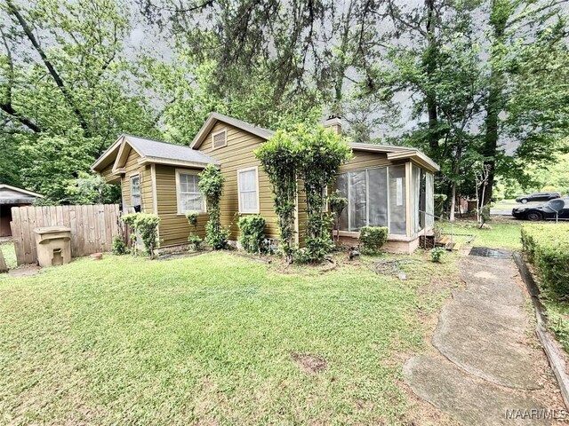 2121 Lauderdale St, Selma, AL 36701 - view of front of property featuring a sunroom and a chimney