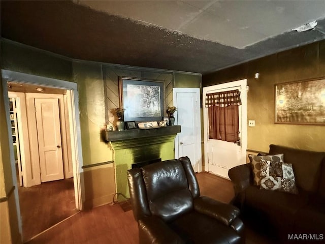 2121 Lauderdale St, Selma, AL 36701 - sitting room featuring wood finished floors and a fireplace