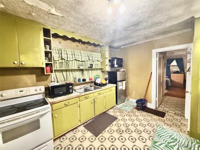 2121 Lauderdale St, Selma, AL 36701 - kitchen featuring white electric range, black microwave, freestanding refrigerator, a sink, and open shelves