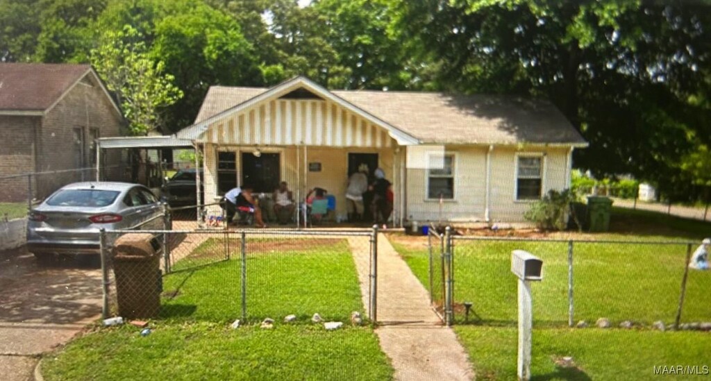 3137 Texas St, Montgomery, AL 36107 - ranch-style house featuring driveway and an attached carport