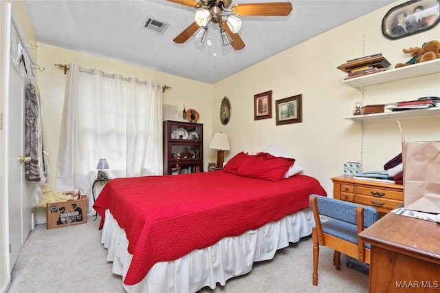 carpeted bedroom featuring a ceiling fan