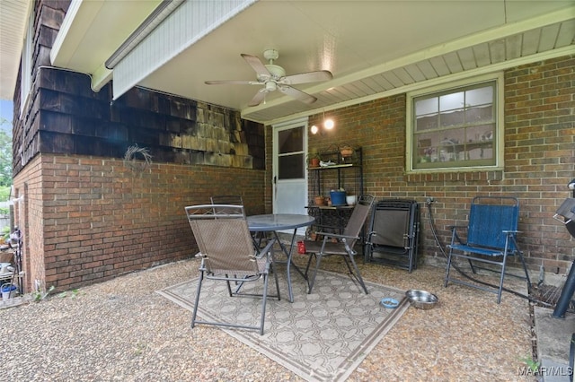 view of patio with a ceiling fan and outdoor dining space