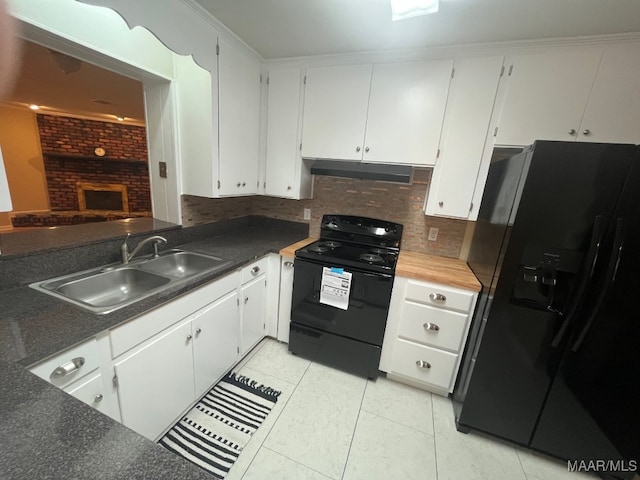 kitchen with black appliances, a sink, under cabinet range hood, backsplash, and light tile patterned flooring
