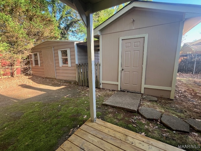 view of shed with fence