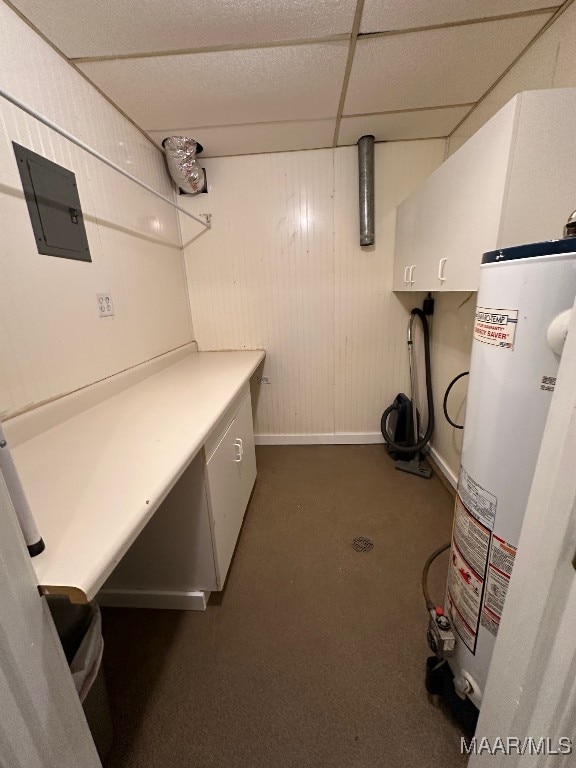 1118 Zephyr Hills Dr, Montgomery, AL 36109 - laundry room featuring gas water heater, cabinet space, dark carpet, electric panel, and baseboards