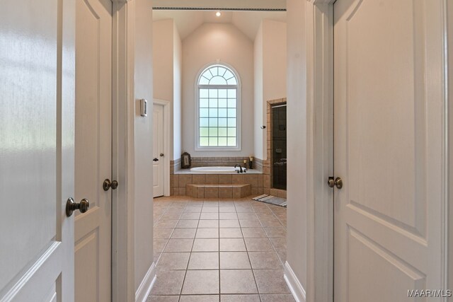 65 Copper Ridge Ct, Deatsville, AL 36022 - full bath featuring tile patterned flooring, a garden tub, and lofted ceiling