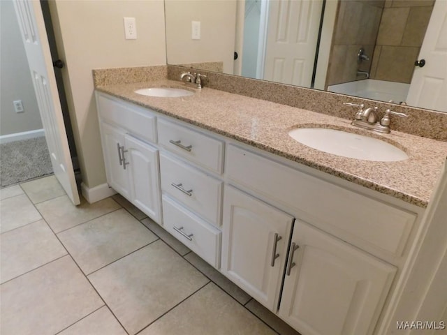 bathroom featuring double vanity, a bath, baseboards, tile patterned flooring, and a shower