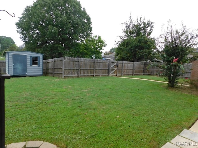 view of yard featuring a shed and an outbuilding