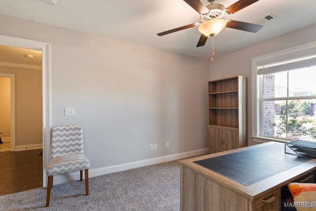 office space featuring baseboards, ceiling fan, and carpet floors