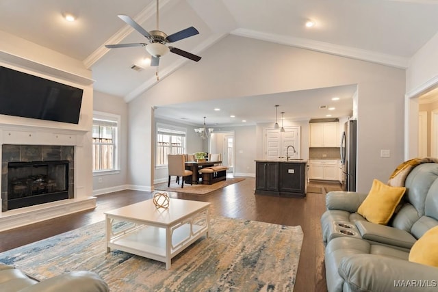 living area featuring a ceiling fan, a fireplace, dark wood-style floors, high vaulted ceiling, and recessed lighting