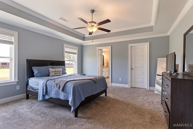 bedroom with a raised ceiling, crown molding, light colored carpet, baseboards, and a ceiling fan