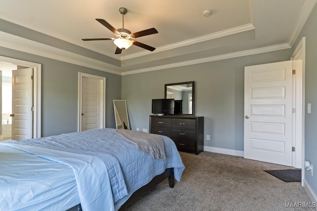 bedroom with a raised ceiling, carpet floors, crown molding, a ceiling fan, and baseboards