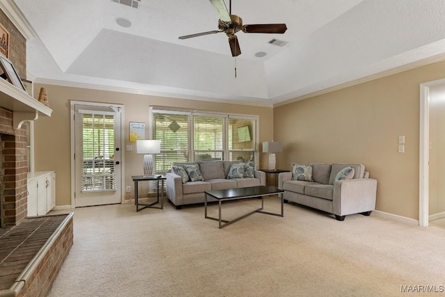 living area featuring a raised ceiling, light carpet, a fireplace, ceiling fan, and baseboards