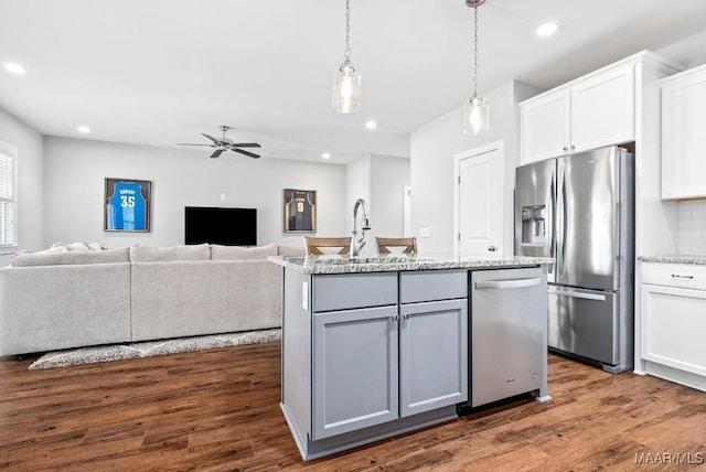 kitchen featuring stainless steel appliances, a ceiling fan, white cabinets, gray cabinets, and dark wood-style floors