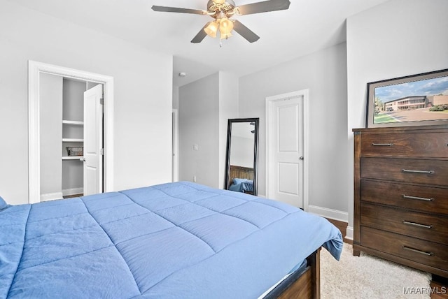 bedroom featuring baseboards and ceiling fan