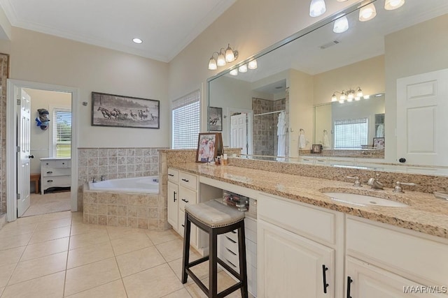 231 Chesson Ct, Fitzpatrick, AL 36029 - full bath featuring tile patterned floors, a bath, a shower stall, ornamental molding, and vanity