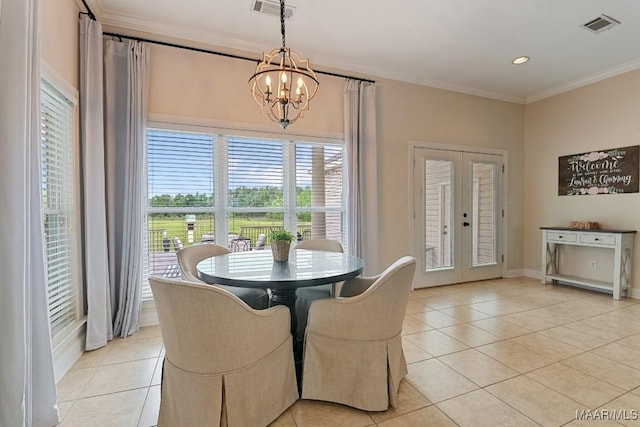 231 Chesson Ct, Fitzpatrick, AL 36029 - dining area with light tile patterned floors, a chandelier, ornamental molding, french doors, and plenty of natural light