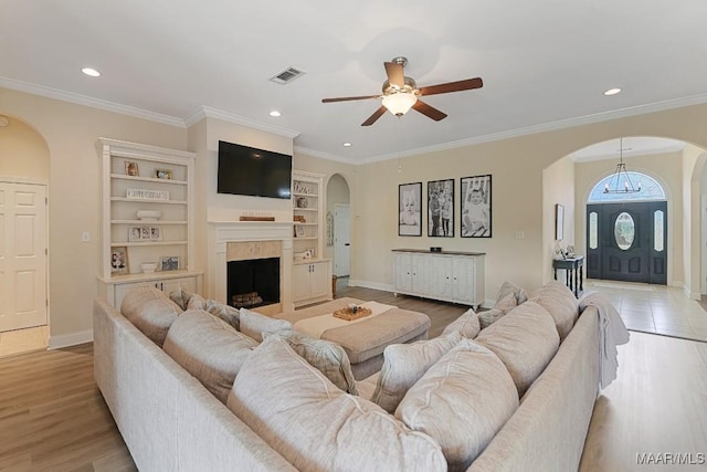 231 Chesson Ct, Fitzpatrick, AL 36029 - living room featuring arched walkways, a ceiling fan, recessed lighting, a fireplace, and baseboards