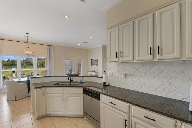 231 Chesson Ct, Fitzpatrick, AL 36029 - kitchen with dishwasher, a sink, a chandelier, a peninsula, and backsplash