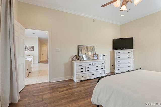 231 Chesson Ct, Fitzpatrick, AL 36029 - bedroom with ornamental molding, wood finished floors, baseboards, arched walkways, and recessed lighting