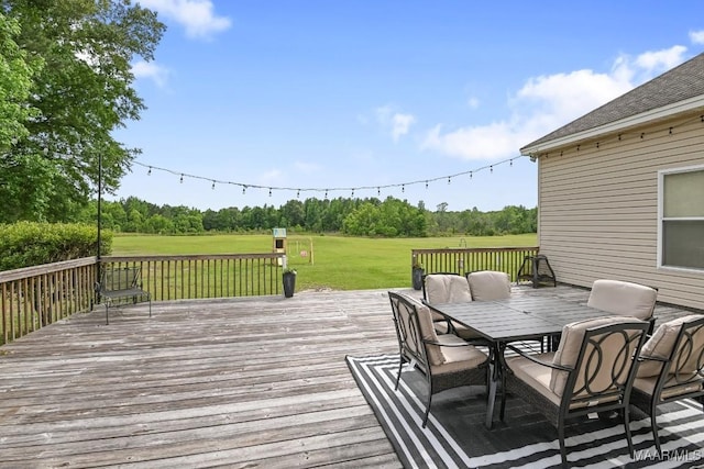 231 Chesson Ct, Fitzpatrick, AL 36029 - wooden deck with outdoor dining area and a lawn
