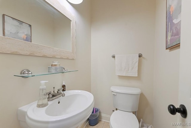 231 Chesson Ct, Fitzpatrick, AL 36029 - half bathroom with a sink, toilet, tile patterned flooring, and baseboards