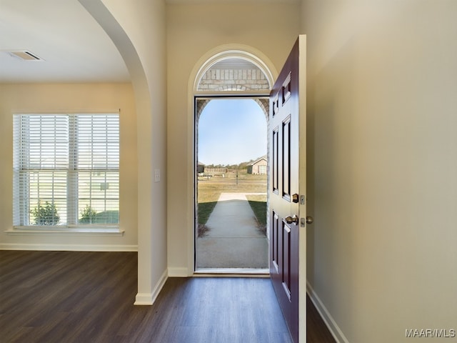 2045 Dawsons Mill Ln, Prattville, AL 36067 - foyer entrance featuring arched walkways, dark wood-type flooring, and baseboards