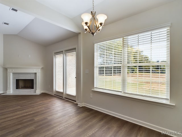 2045 Dawsons Mill Ln, Prattville, AL 36067 - unfurnished living room featuring lofted ceiling, dark wood-style floors, a chandelier, a tile fireplace, and baseboards