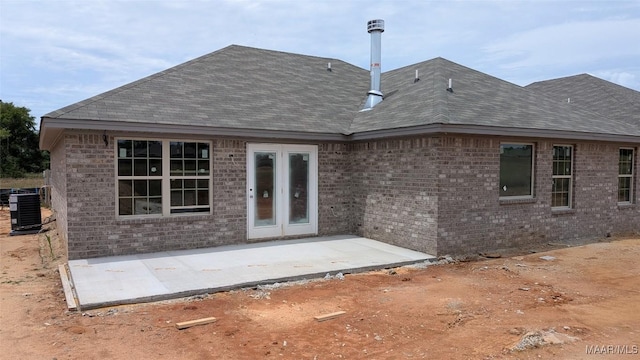 2045 Dawsons Mill Ln, Prattville, AL 36067 - rear view of property with central AC, a patio, brick siding, and roof with shingles